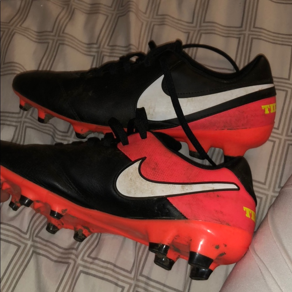 Black and orange Nike cleats